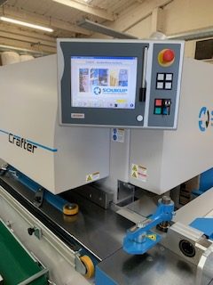 Schuco Crafter CNC machine with touchscreen control panel in a workshop setting
