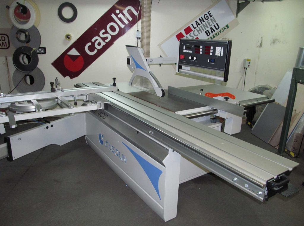 Casolin panel saw with sliding table and digital control panel displayed in a workshop showroom
