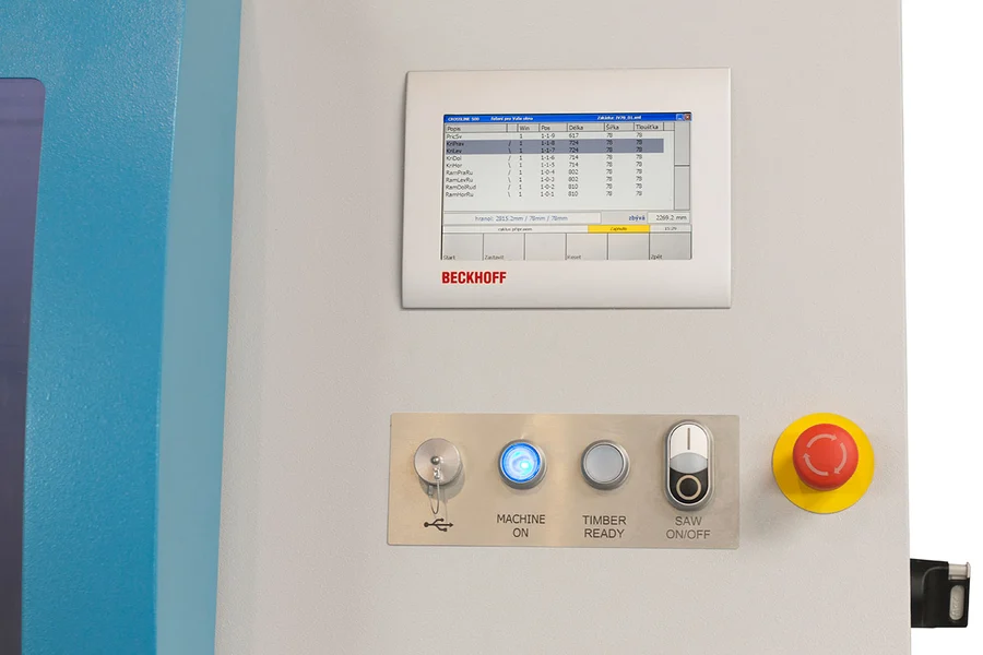 Beckhoff touchscreen control panel on a Soukup Crossline 500 cross cut saw with Machine On, Timber Ready, Saw On/Off buttons and emergency stop
