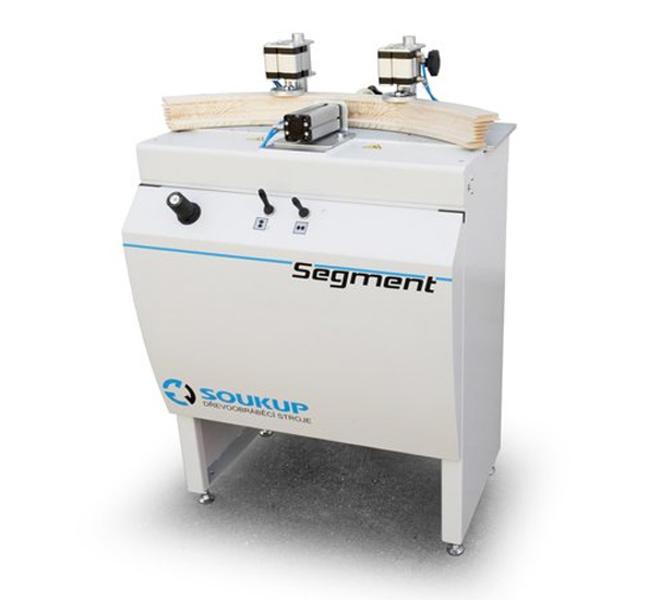 Soukup Segment woodworking machine with dual top-mounted clamps and control panel on white cabinet