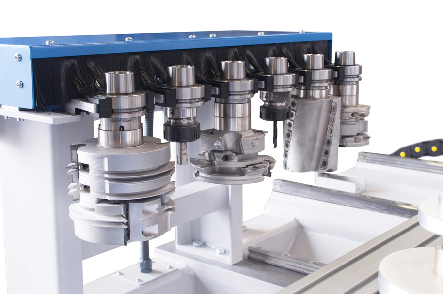 Multiple CNC spindle tool heads with milling cutters mounted on a Soukup Spectra CNC machining centre