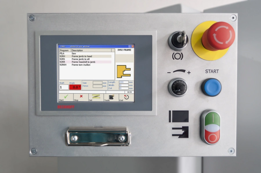 Soukup Temac machine control panel with touchscreen display, red emergency stop, blue start button, and rotary dial