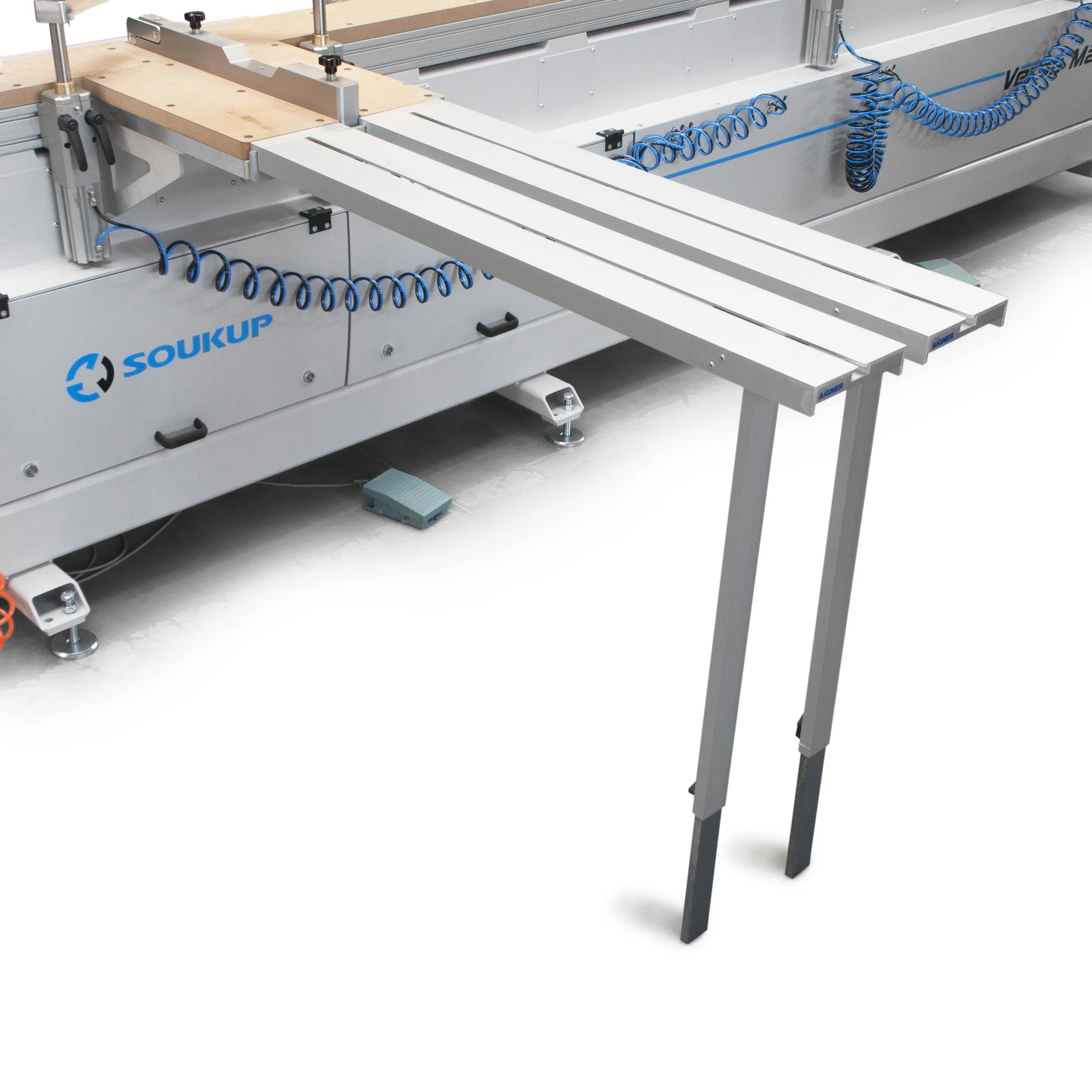 Adjustable support table extending from the side of the Soukup Versa Max to carry long window and door components during cross-machining
