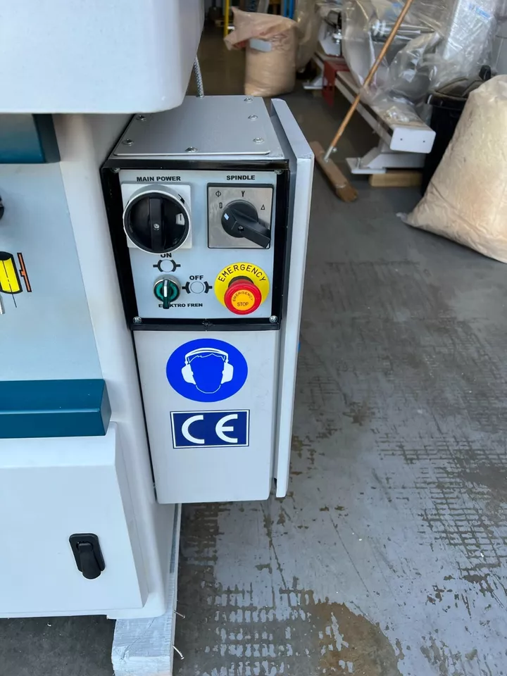 Spindle moulder control panel with main power switch, spindle selector, emergency stop button, and CE marking