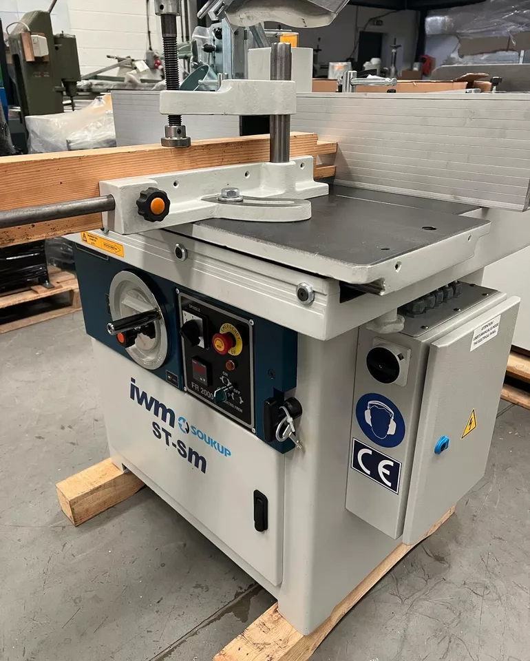 IWM Soukup ST-SM spindle moulder with sliding table on a wooden pallet in a workshop