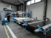 Soukup Pontec CNC machining centre with blue fittings and dual worktables inside an industrial workshop