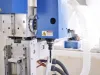 Close-up of the Soukup Versa Max main spindle carrying a mortising cutter, with the tilting head casting, linear guides and extraction ducting behind
