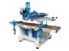 Pouwels DEF-50 stair making machine with blue and white frame, routing head, and brown worktop surface