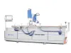 Soukup Versa Max CNC window machining centre in white and blue, showing the full-length worktable, pneumatic clamps, tilting milling head and touchscreen control arm