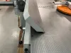 Close-up of a heavy-duty 500mm wide IWM Soukup surface planer with a tilting fence in a workshop