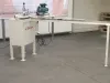 Dan-List PME 100 Endscribe machine with extended outfeed table on a concrete workshop floor, with pallets visible in the background.