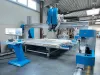 Soukup Pontec CNC machining centre with blue gantry, large work table, and control monitor in a workshop