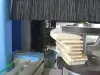 Soukup Arcus machining centre cutting curved wooden arch profiles, with rotating brush guard and milling spindle visible
