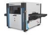 Baromak Morbido 1300 industrial machine with grey and dark grey casing, blue LED strips, red emergency stop button and a flat feed table.