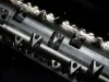 Close-up of triangular carbide cutting teeth mounted along the steel shaft of a Robust SD90 Shredder rotor