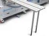 Adjustable support table extending from the side of the Soukup Versa Max to carry long window and door components during cross-machining