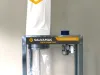 Salvamac mobile bagging dust extractor with white filter bag, clear collection sack, and electric motor on a steel frame