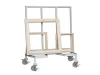 Metal trolley on castors holding multiple wooden and aluminium window frames of varying sizes upright
