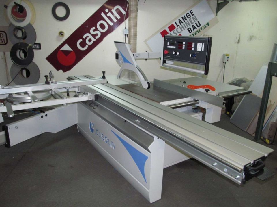 Casolin panel saw with sliding table and digital control panel displayed in a workshop showroom