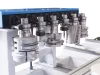 Multiple CNC spindle tool heads with milling cutters mounted on a Soukup Spectra CNC machining centre