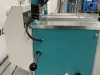 Teal and silver HEP glazing bead end profile scribing machine on a workbench in a workshop