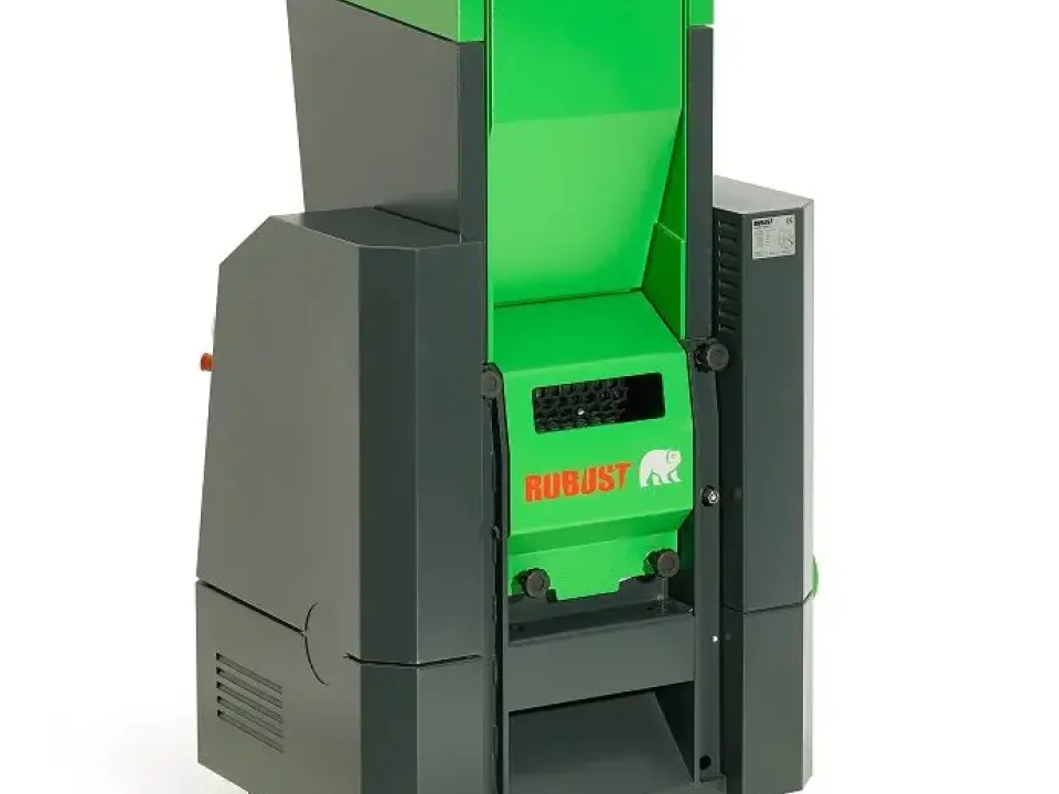 Robust branded industrial shredder machine in green and dark grey with a large hopper feed opening