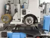 Close-up of a Soukup fourside planer and moulder spindle head with rotating cutter block and feed roller assembly