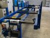 IWM 4 piston hydraulic stair cramp machine with blue steel frame and hydraulic unit, positioned on a concrete workshop floor