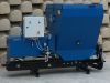 Falach 70 briquette machine in blue with a control panel featuring start, stop and off buttons, mounted on a black steel frame