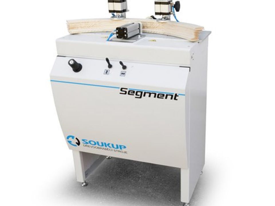 Soukup Segment woodworking machine with dual top-mounted clamps and control panel on white cabinet