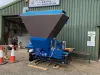 Falach 100 briquette machine in blue, on a pallet outside A. Fairnington Joiner workshop in Northumberland
