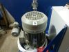Grey industrial electric motor labelled number 2 with a red directional arrow, mounted on a Falach 70 Briquette Machine