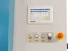 Beckhoff touchscreen control panel on a cross cut saw with Machine On, Timber Ready, Saw On/Off buttons and a yellow emergency stop