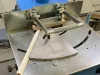 Crossline 500 Copenstick end scribe machine with angled metal table, holding a white window beading profile ready for scribing.