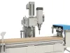Cutaway view of the Soukup Versa Max working units — three-spindle vertical drilling head, main milling spindle and linear tool magazine above the MDF worktable