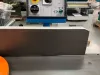 IWM Soukup heavy duty surface planer control panel with emergency stop button, rotary switches, and elektro brake dial in a workshop