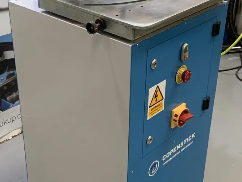 Copenstick woodworking machinery glazing beading machine with blue cabinet, red emergency stop button, and metal work table